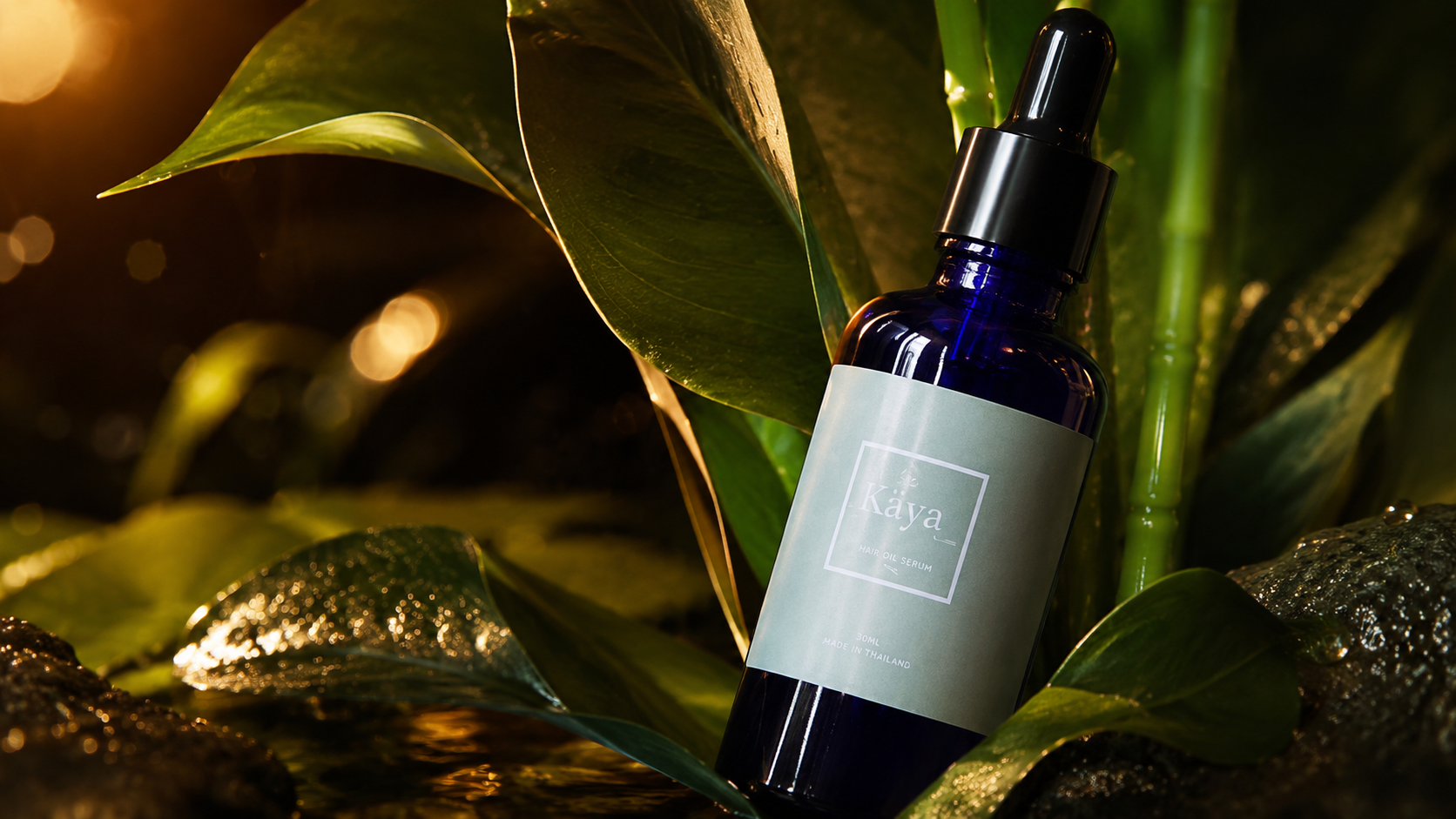 Kaya bottle staged in a tropical botanical setting with reflective water and leaves